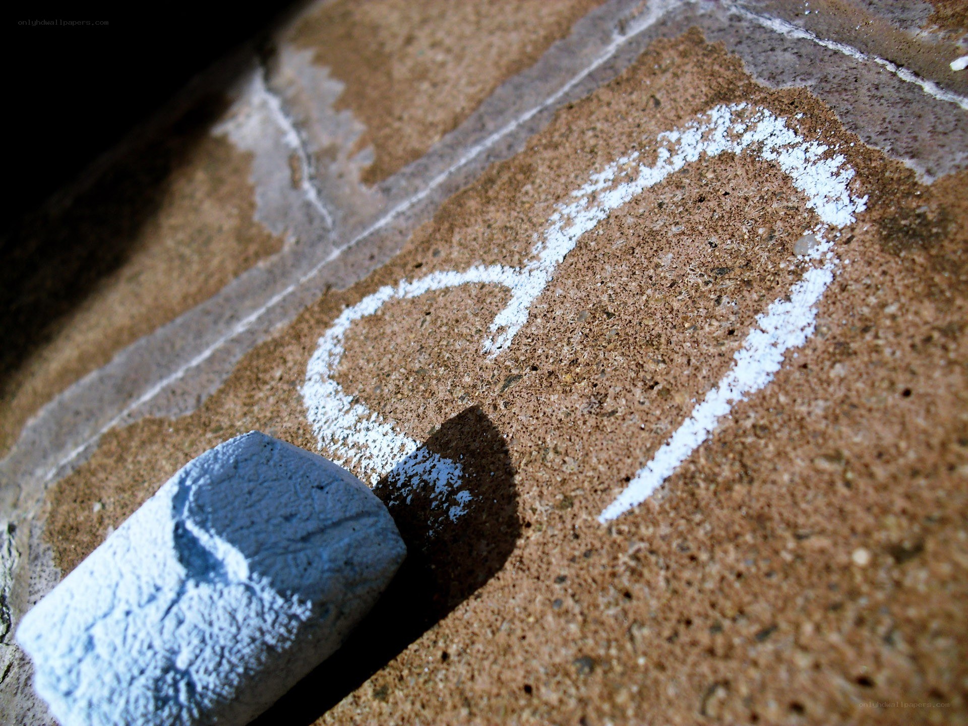 heart drawn with chalk on pavement