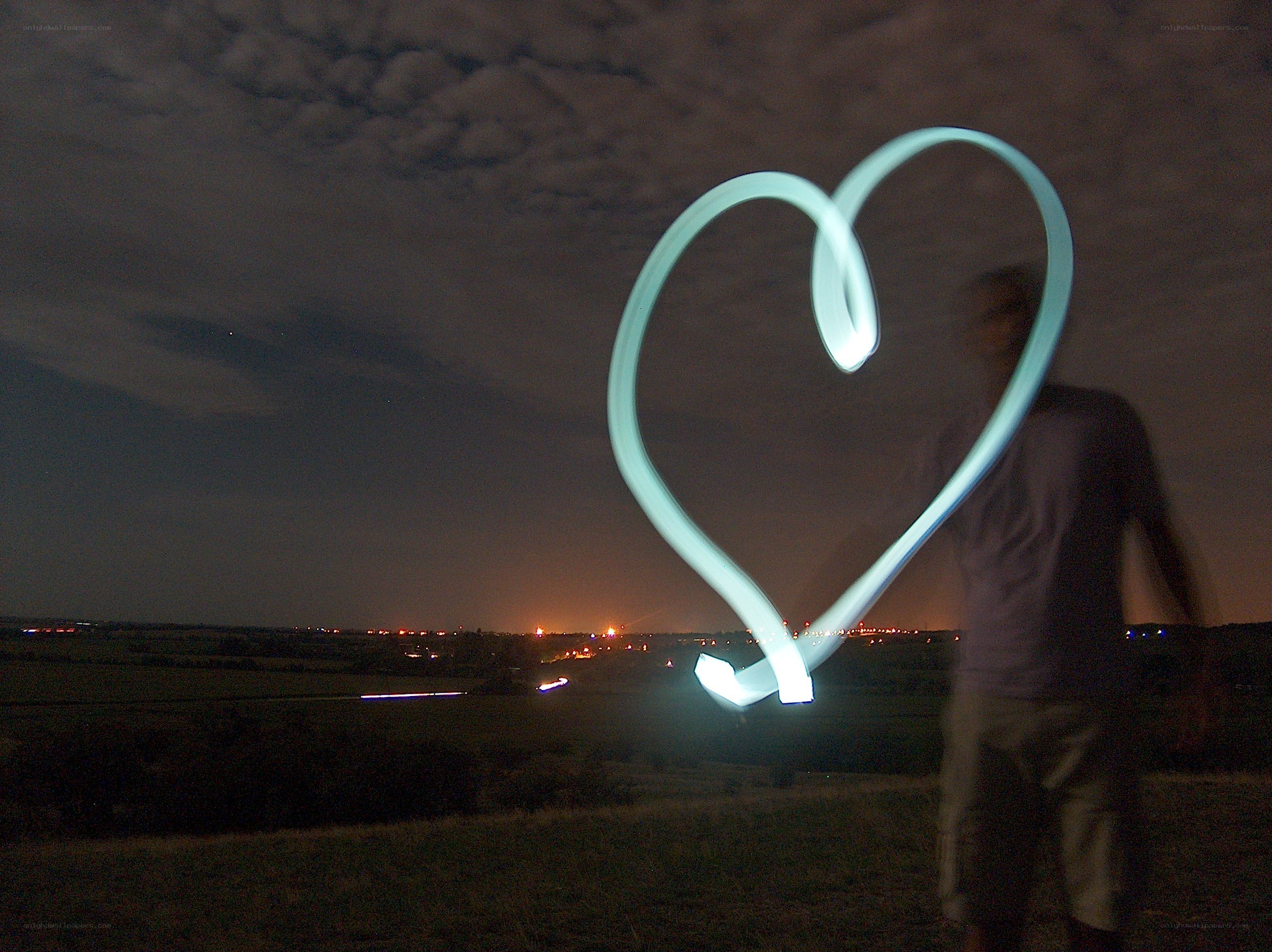 Heart light painting at night