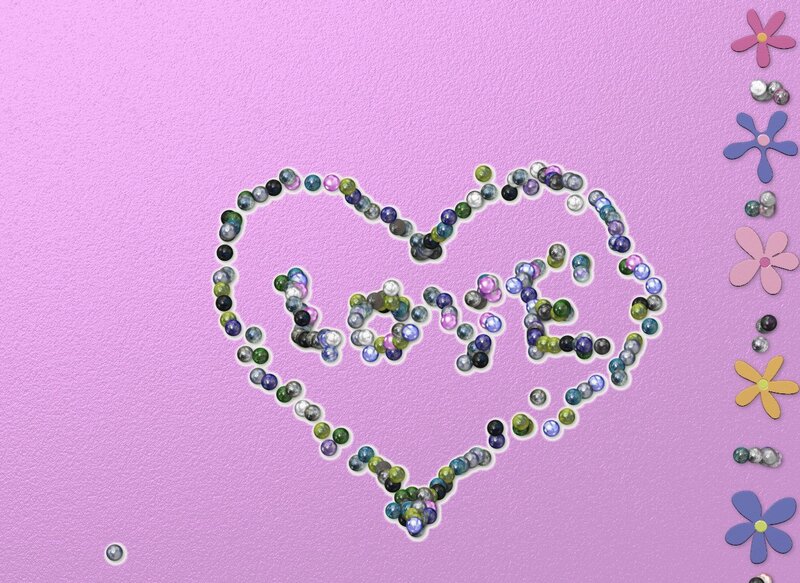 Heart made of marbles with the word love