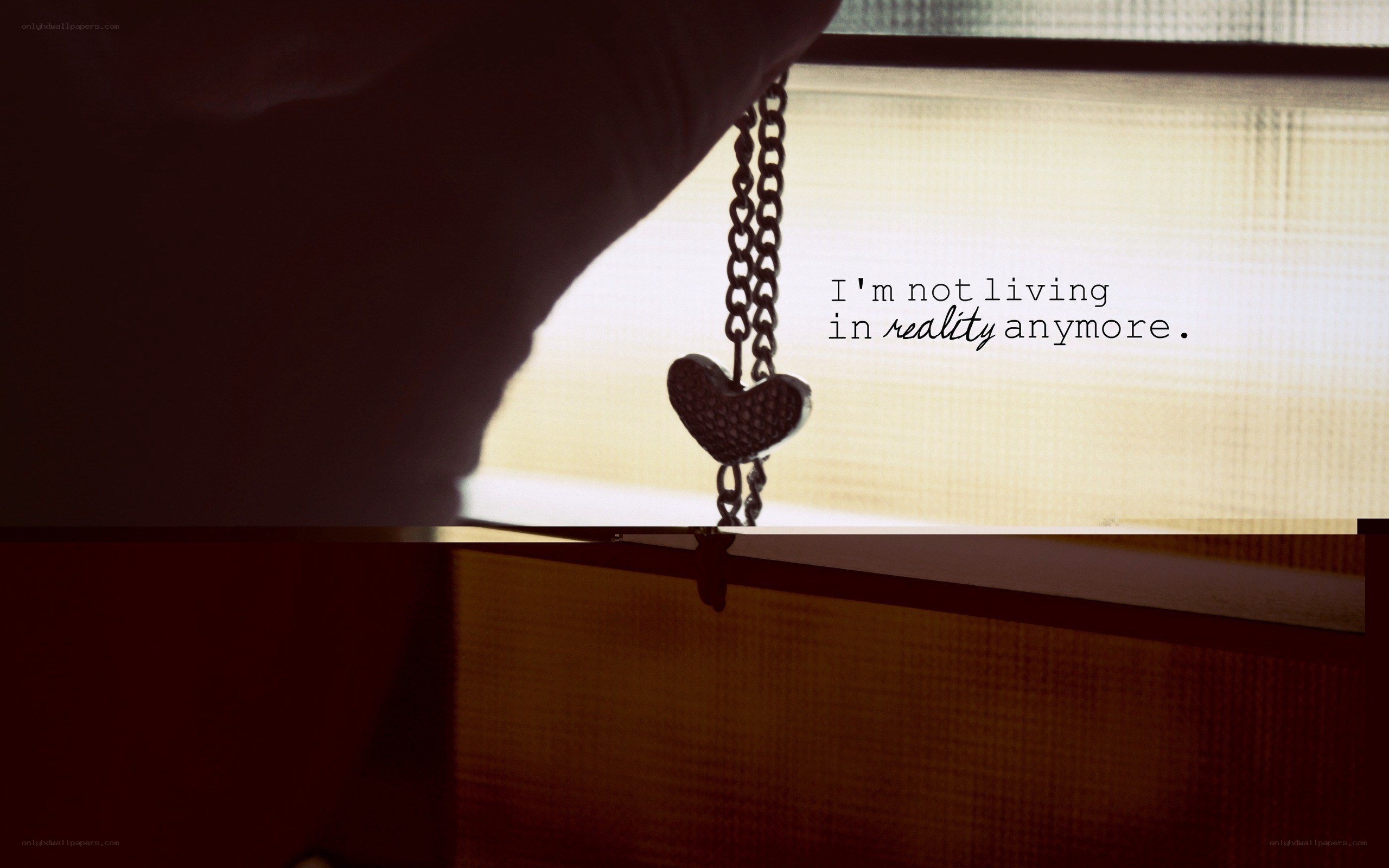 heart necklace by window