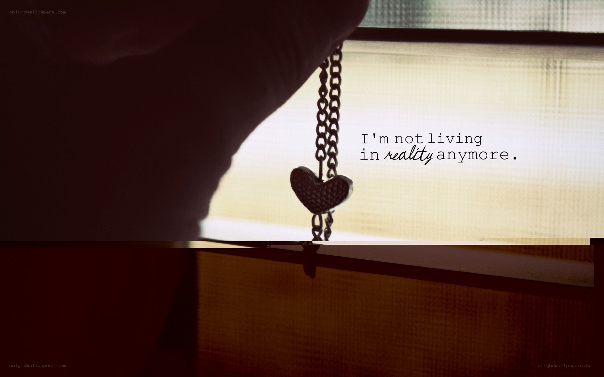 heart necklace by window