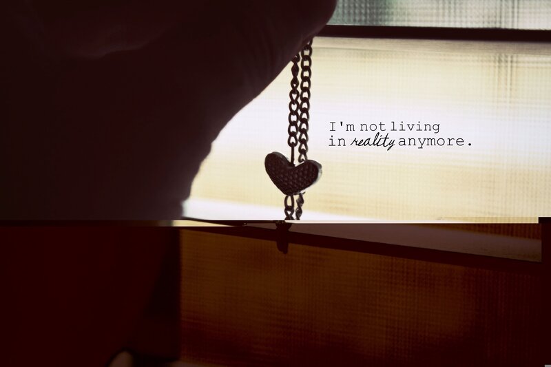 heart necklace by window