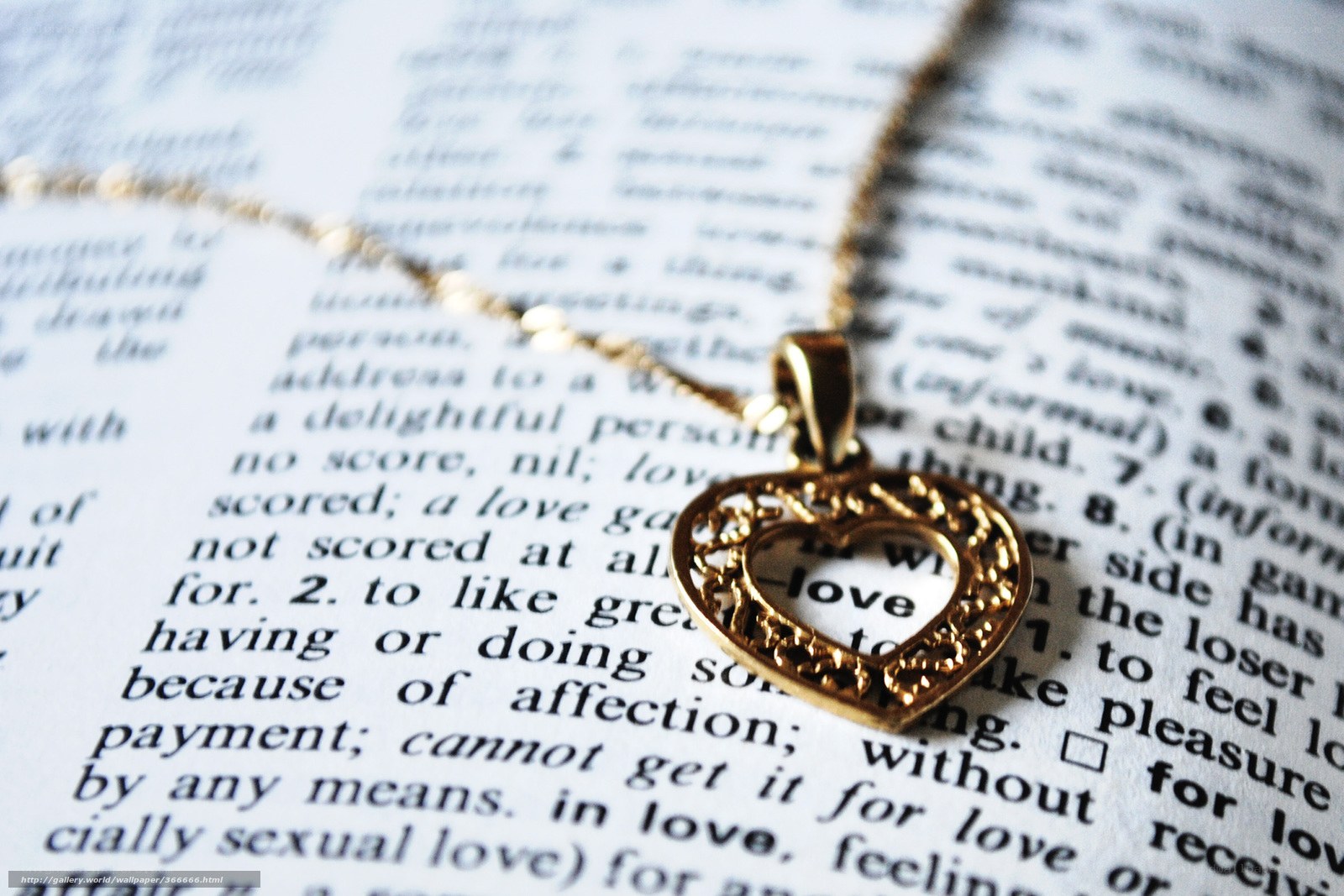 heart necklace on book page