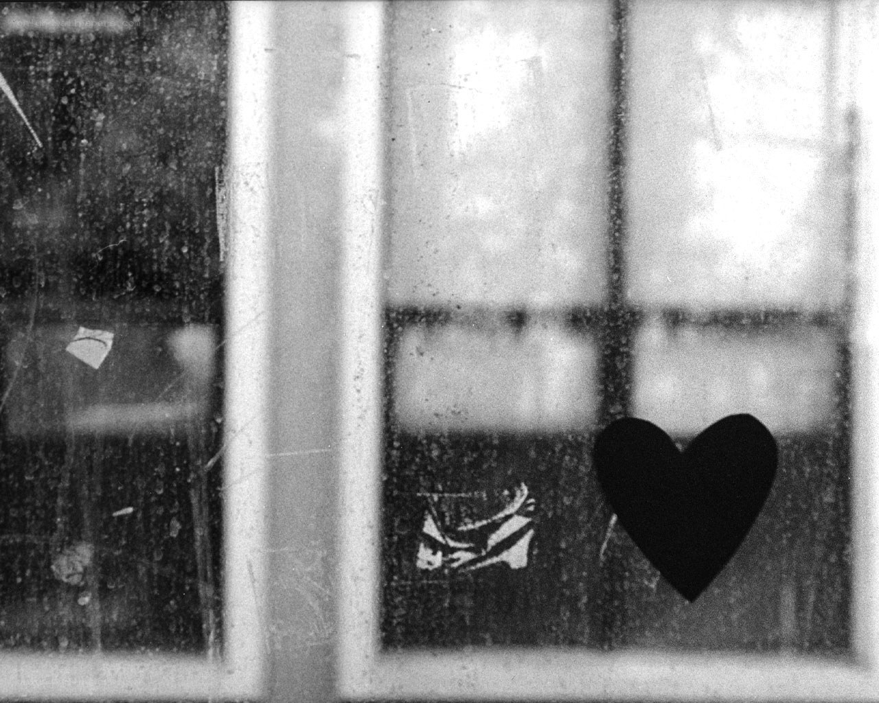 heart on a dirty window