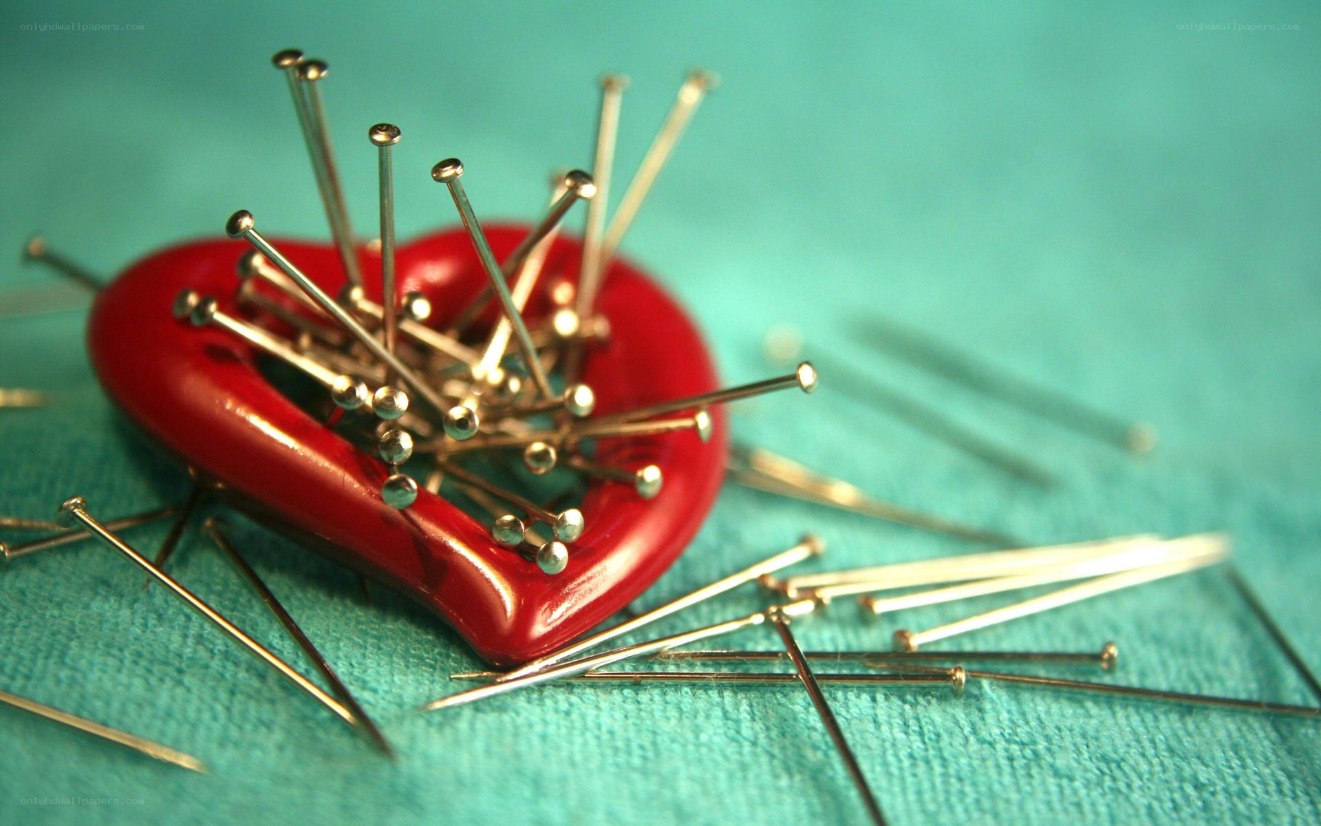 Heart pierced by pins