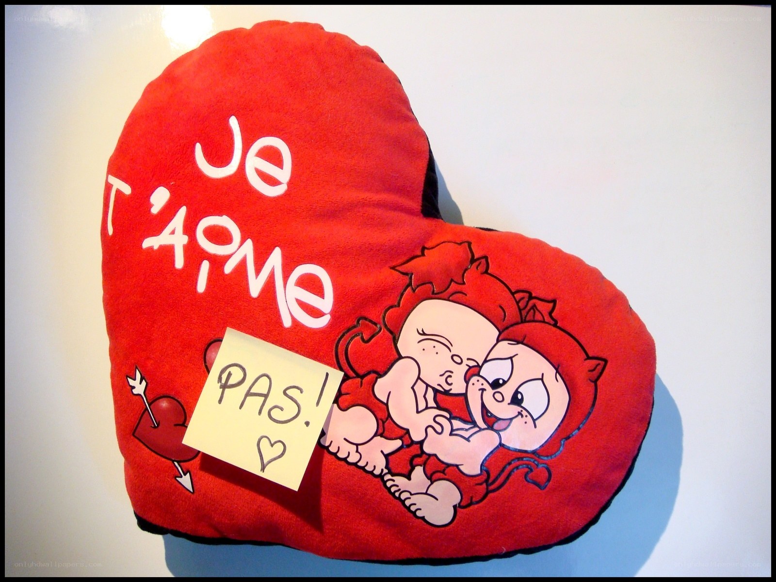 heart pillow with cartoon characters