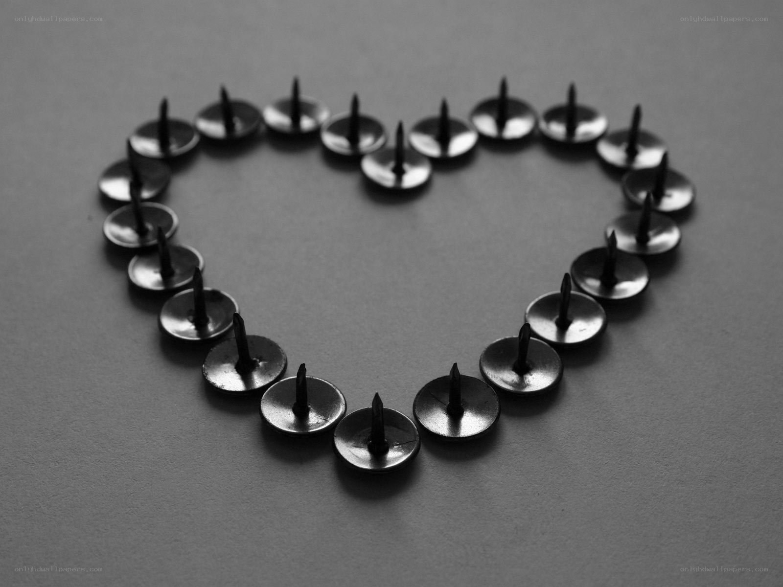 Heart shape made of thumbtacks