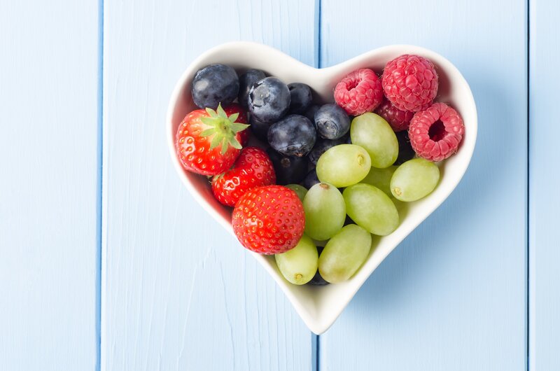 heart-shaped bowl of mixed berries