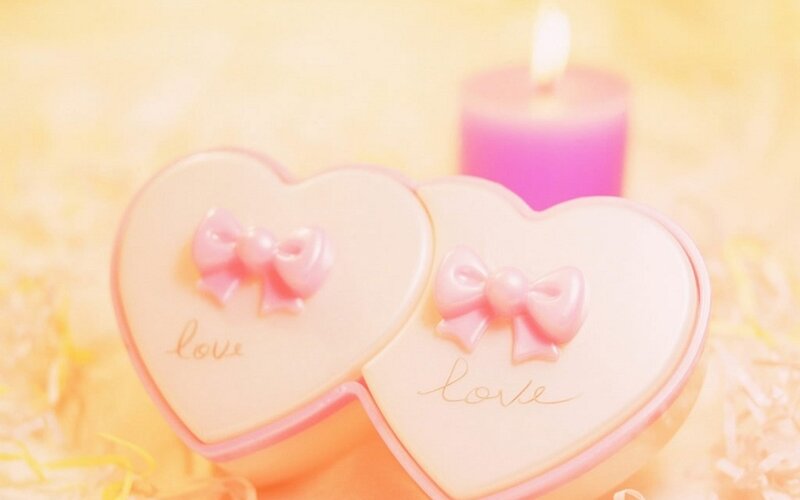 heart-shaped boxes with candles