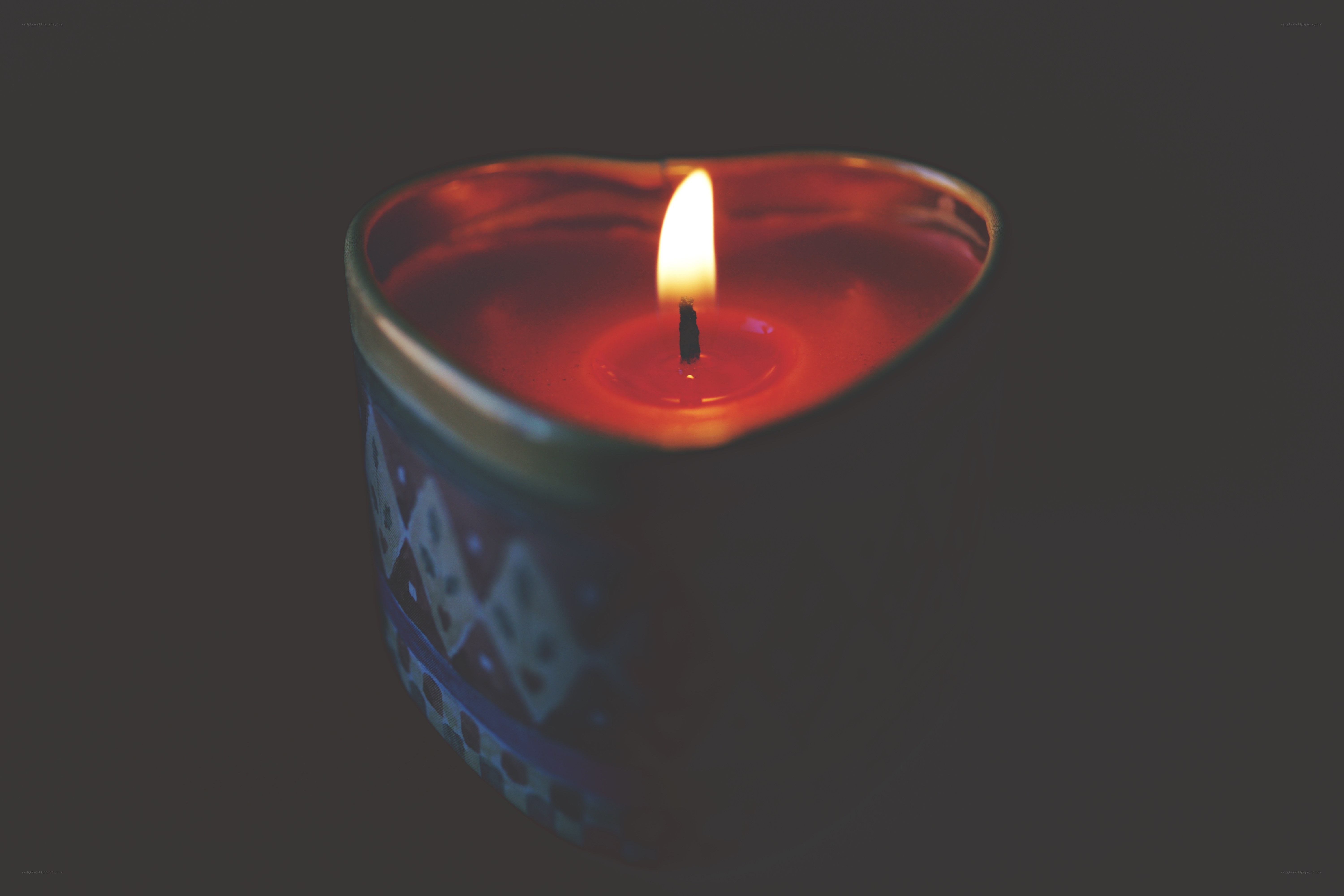 heart-shaped candle burning