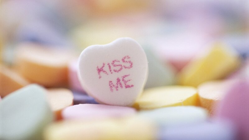 heart-shaped candy with 'kiss me'