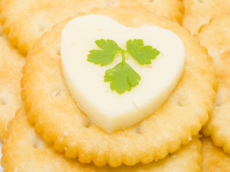 heart-shaped cheese on cracker