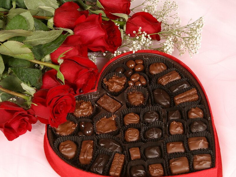 heart-shaped chocolate box with roses