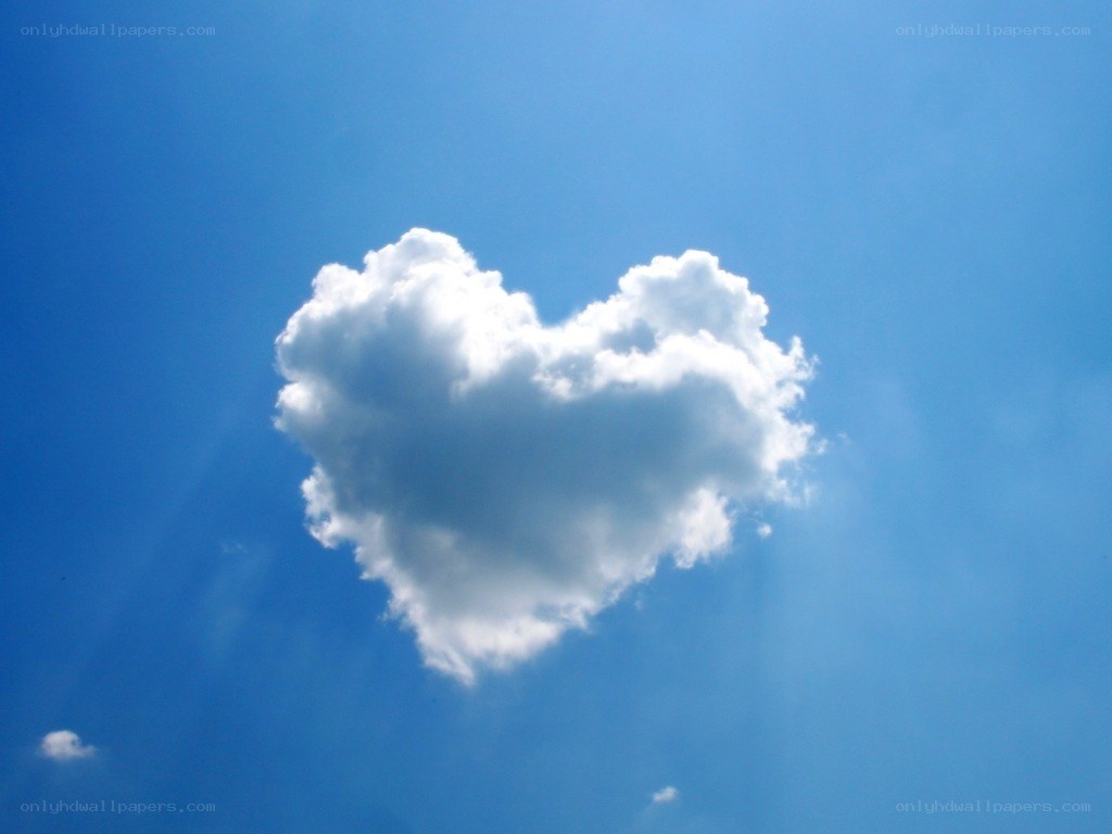 heart-shaped cloud in blue sky