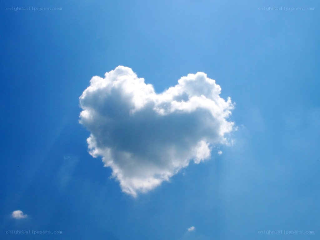 Heart-shaped cloud in blue sky
