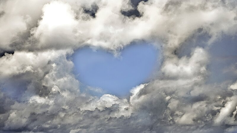 heart-shaped cloud in sky