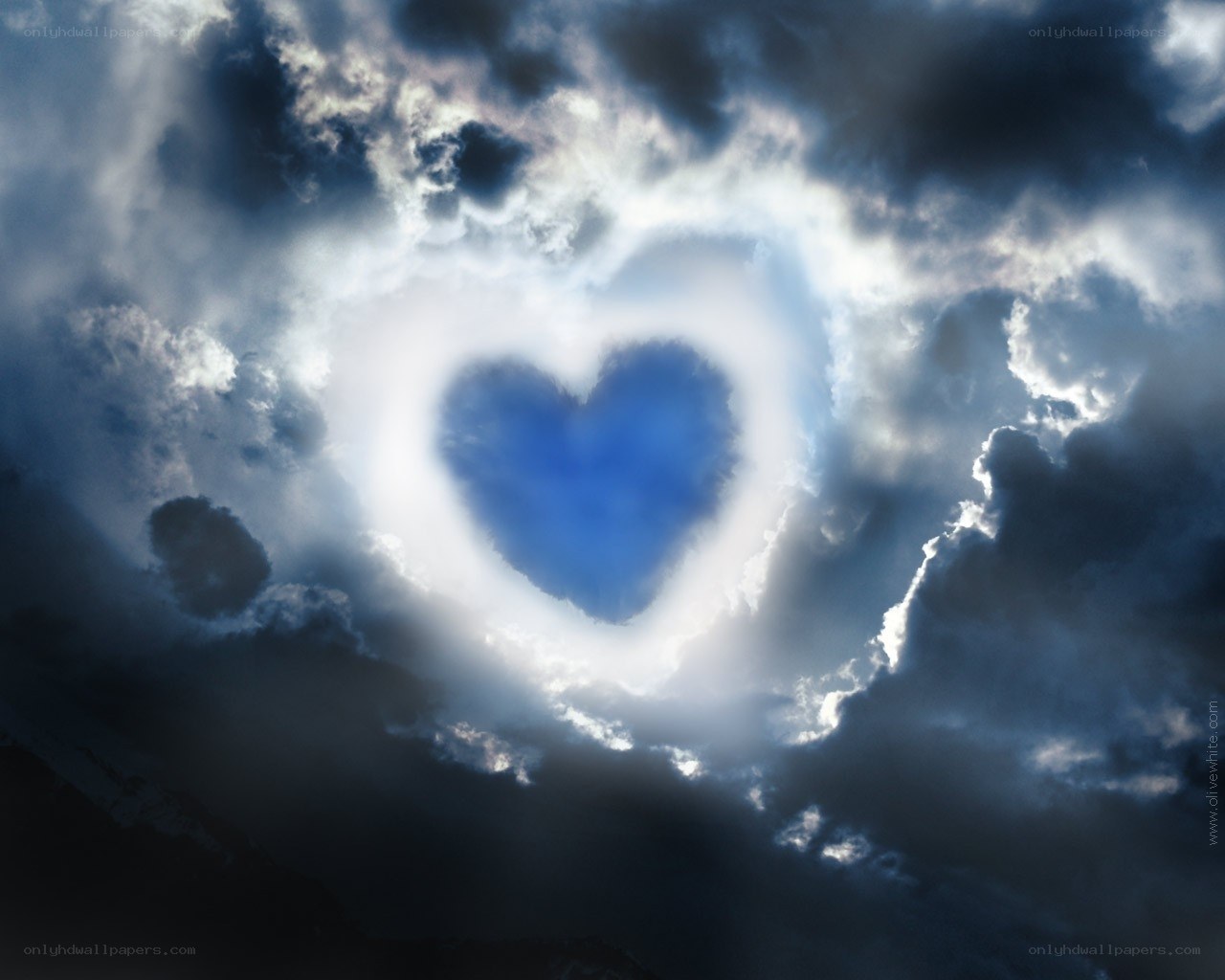 heart-shaped cloud in stormy sky