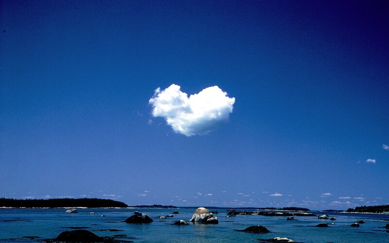 Heart-shaped cloud over the sea