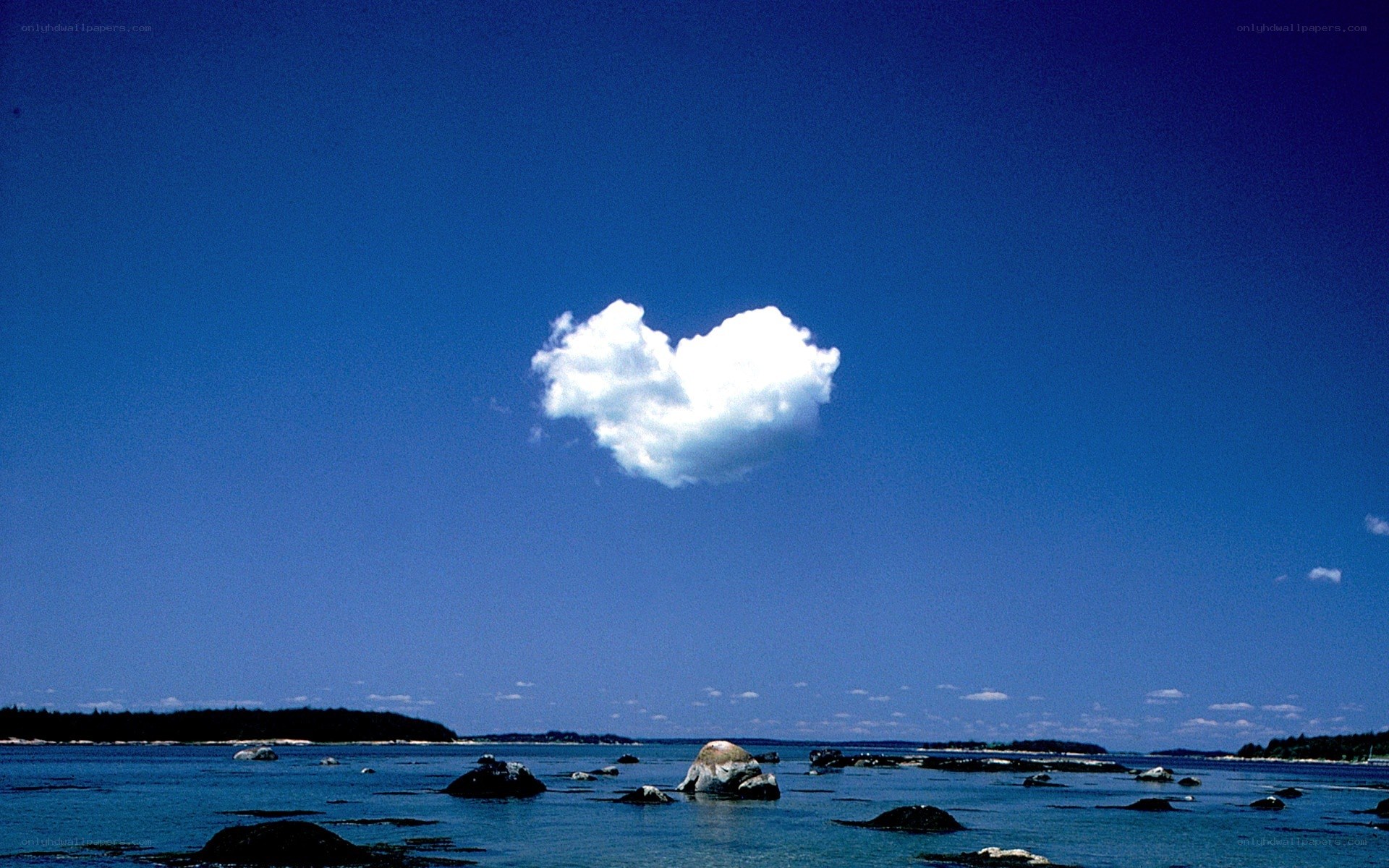 Heart-shaped cloud over the sea
