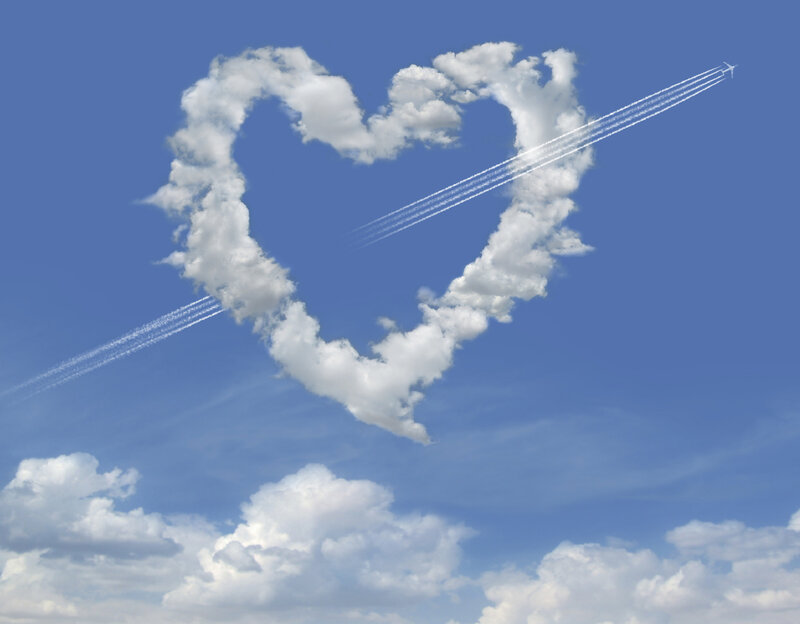 Heart-shaped cloud with airplane trails