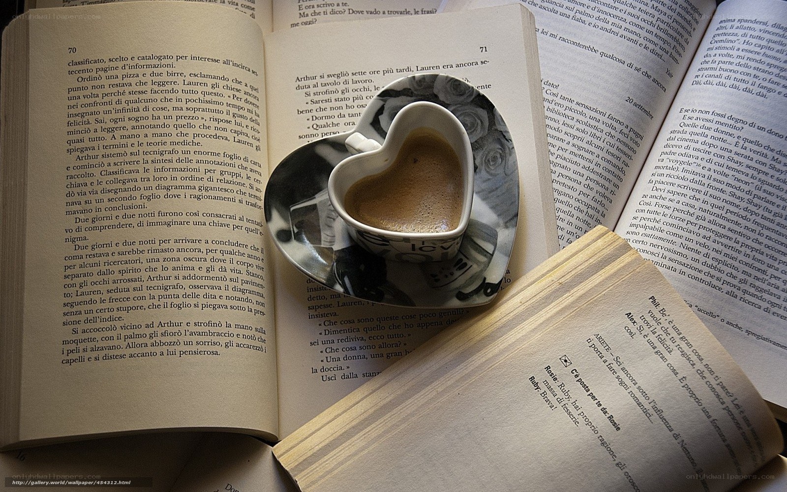 heart-shaped coffee cup on book