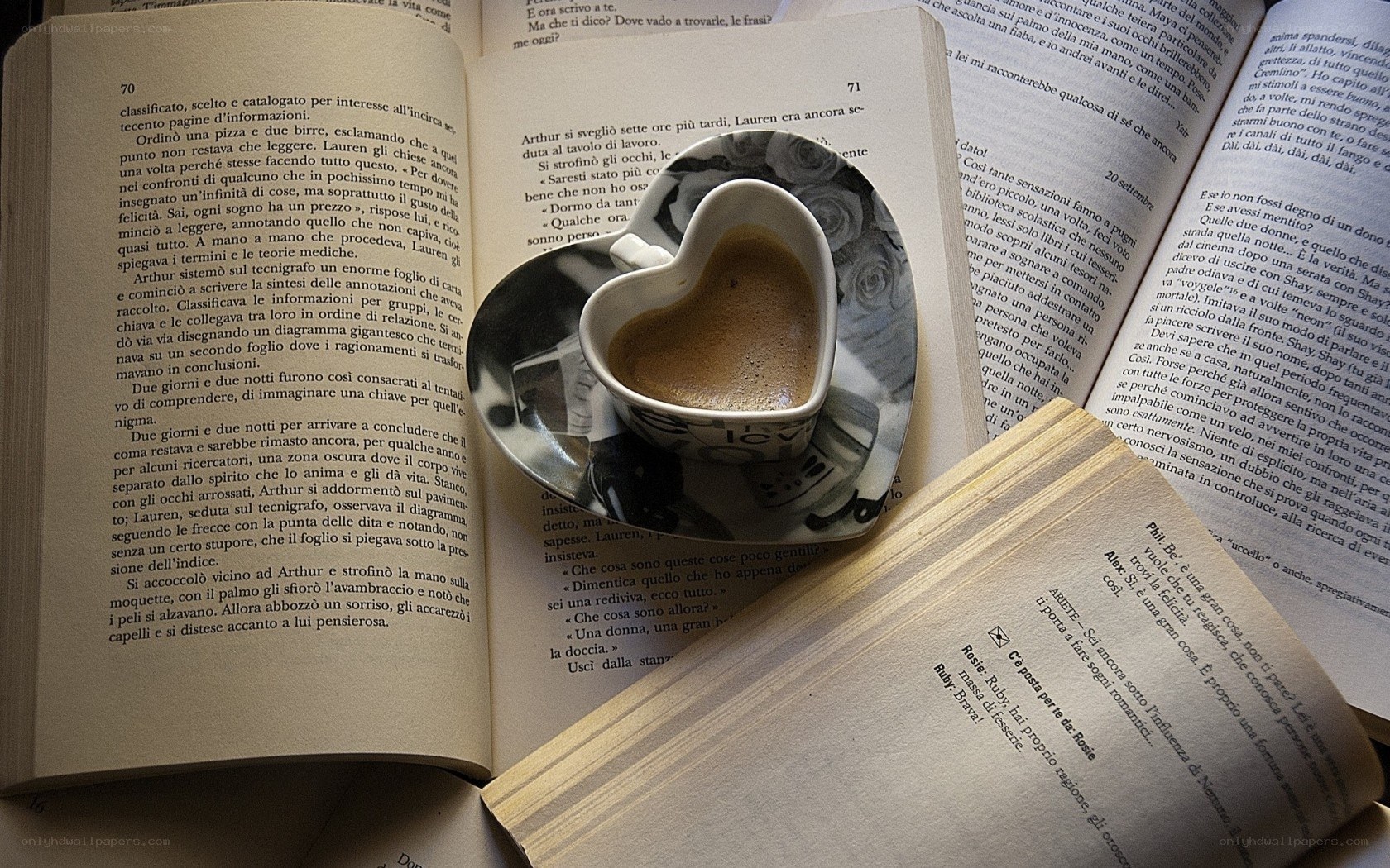 heart-shaped coffee cup on books