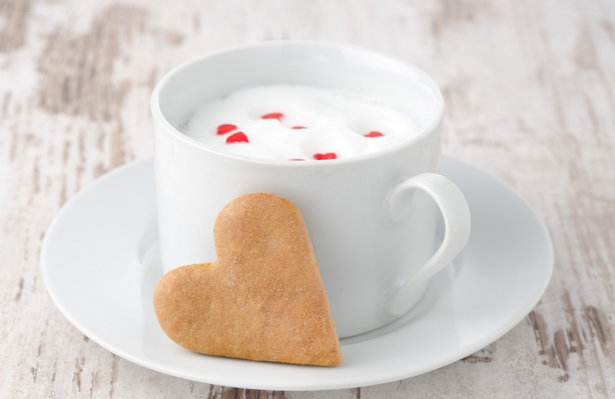 heart-shaped cookie with coffee