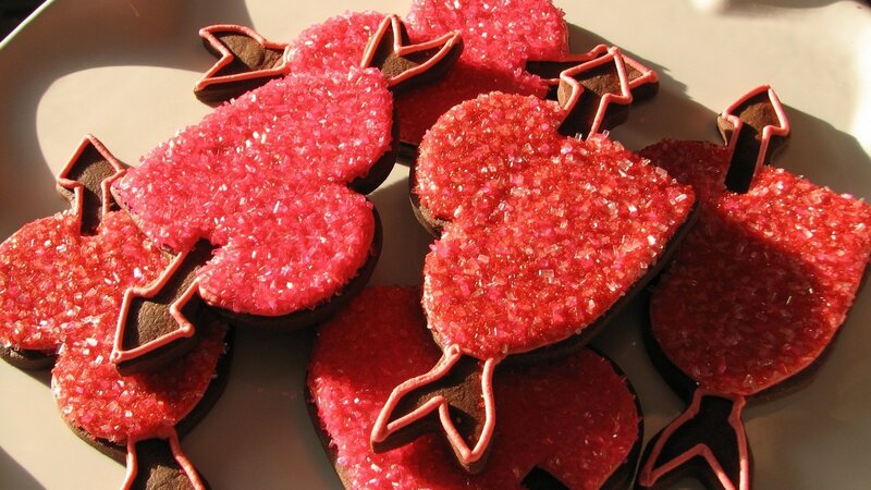 heart-shaped cookies with red sprinkles