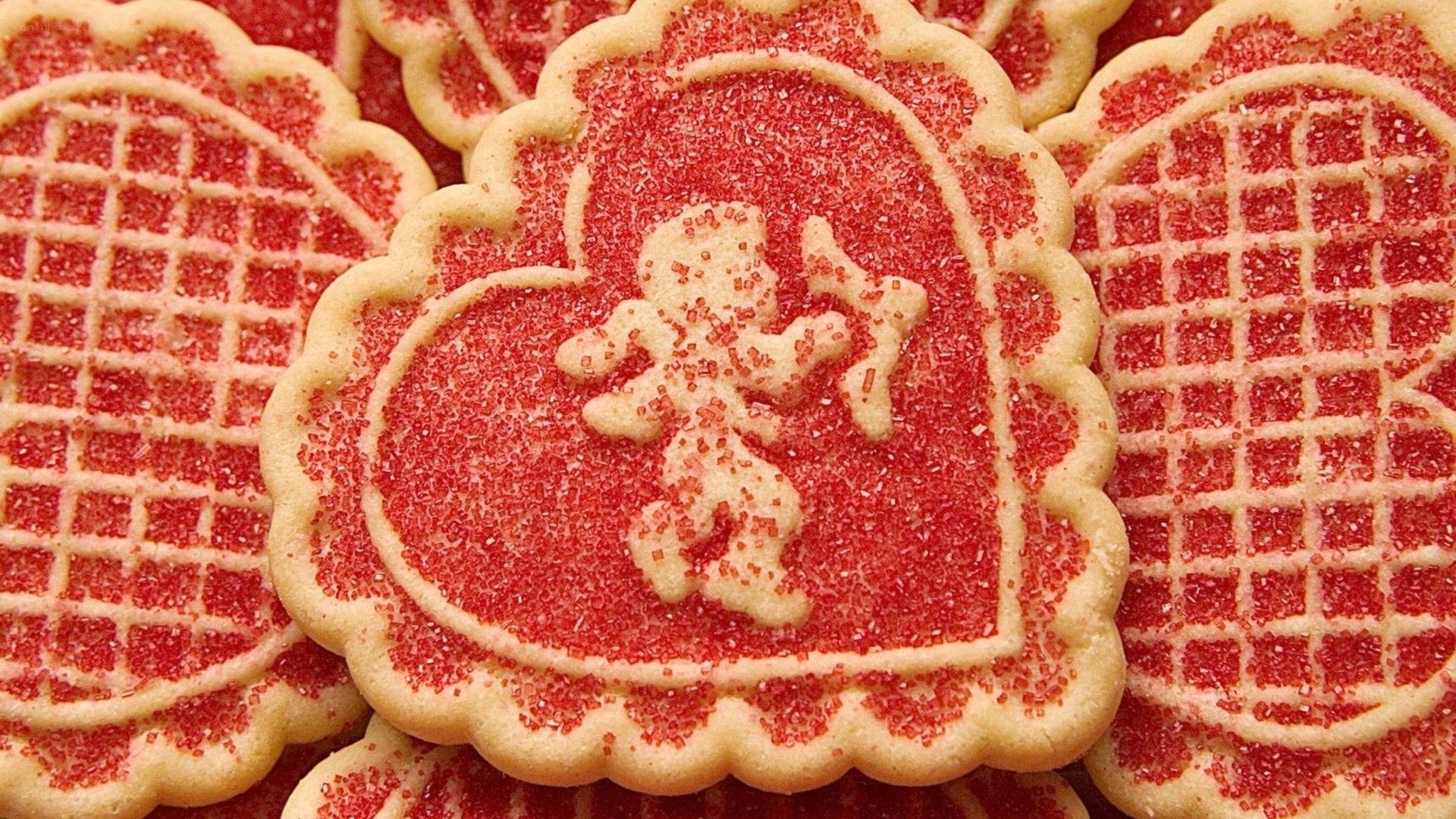 heart-shaped cookies with red sugar