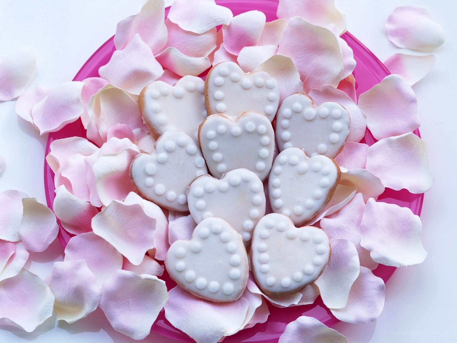 heart-shaped cookies with rose petals