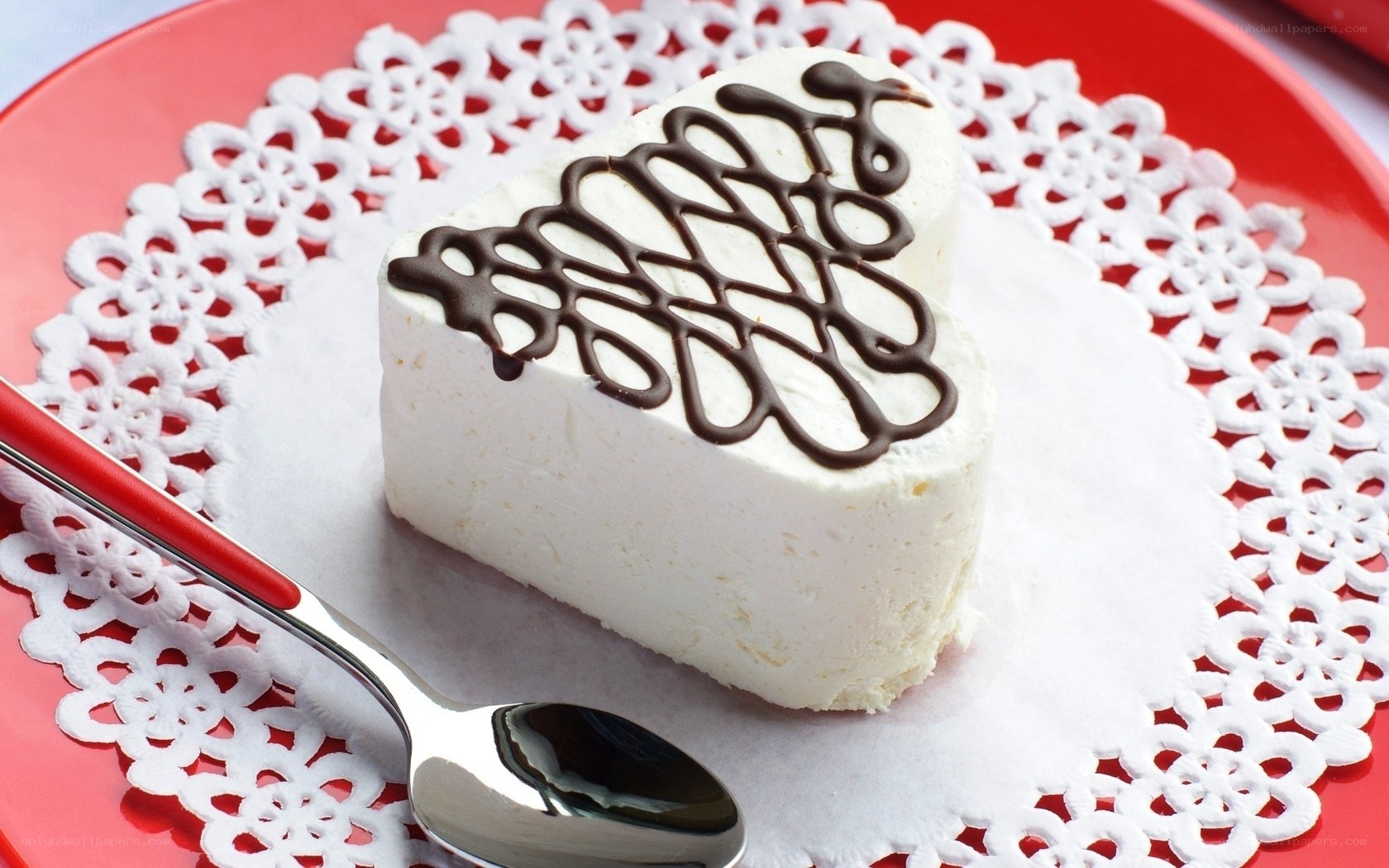 heart-shaped dessert on red plate