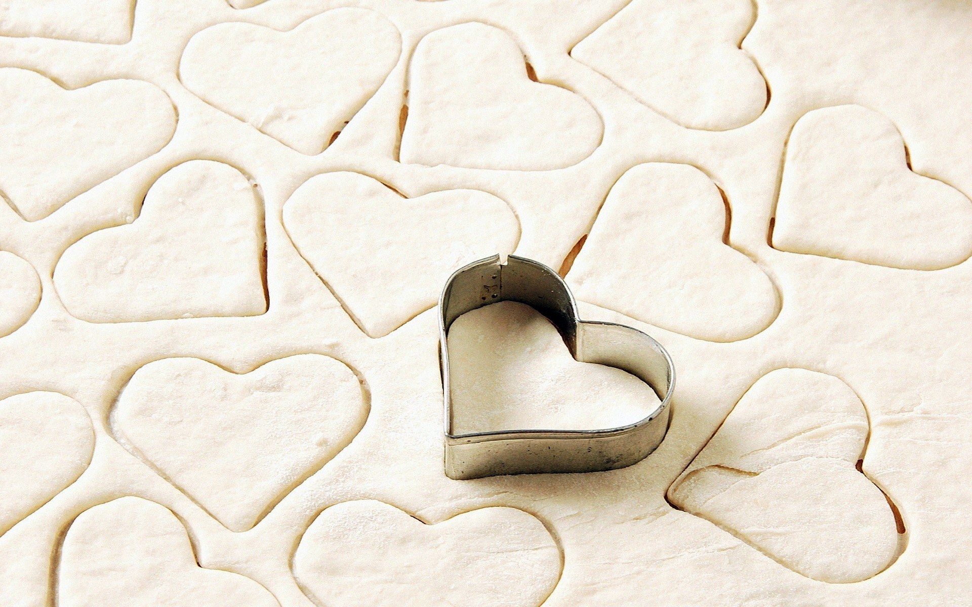 Heart-shaped dough cutouts