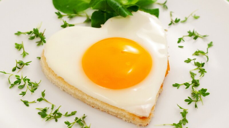 heart-shaped fried egg on toast