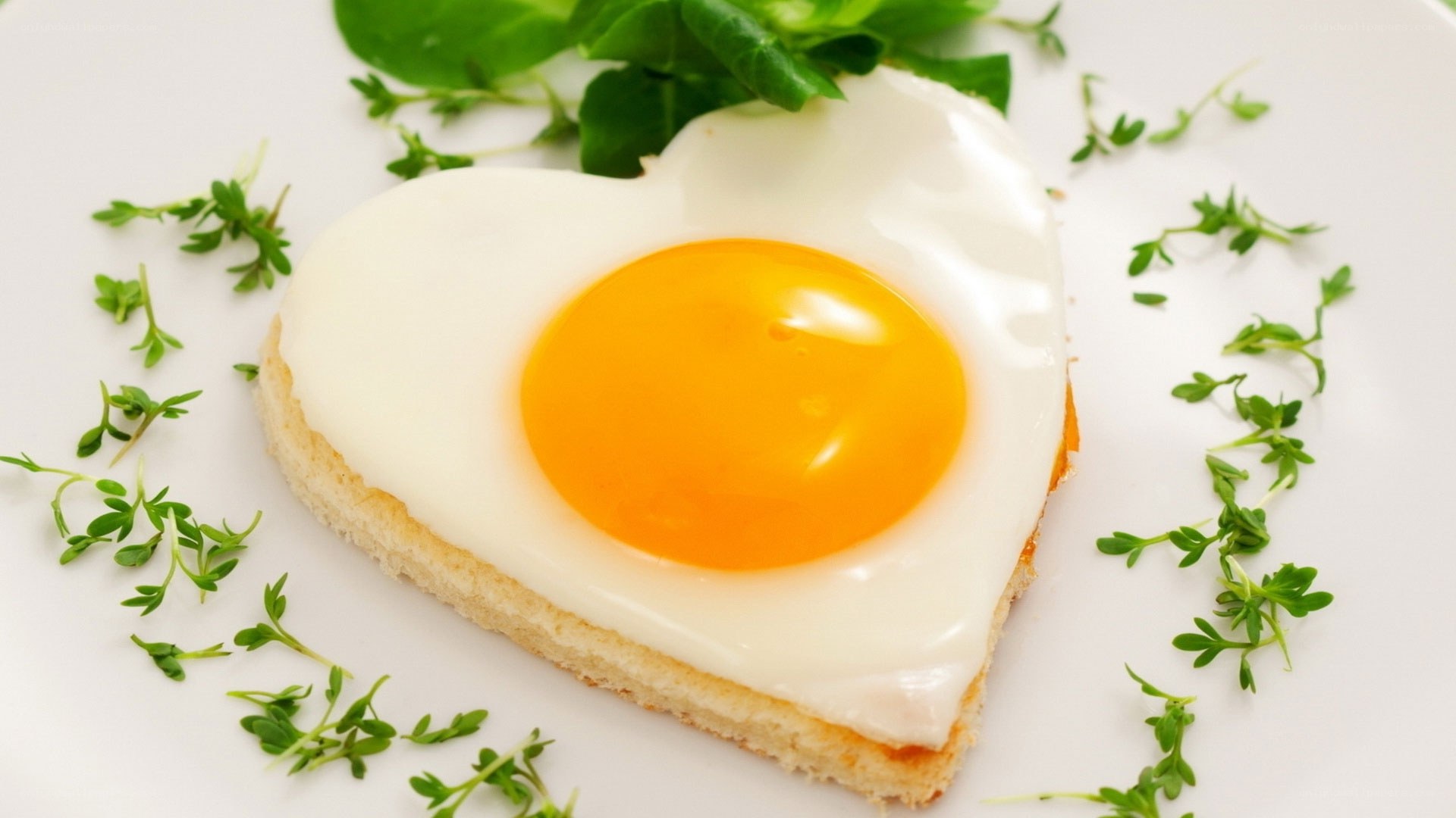 heart-shaped fried egg on toast