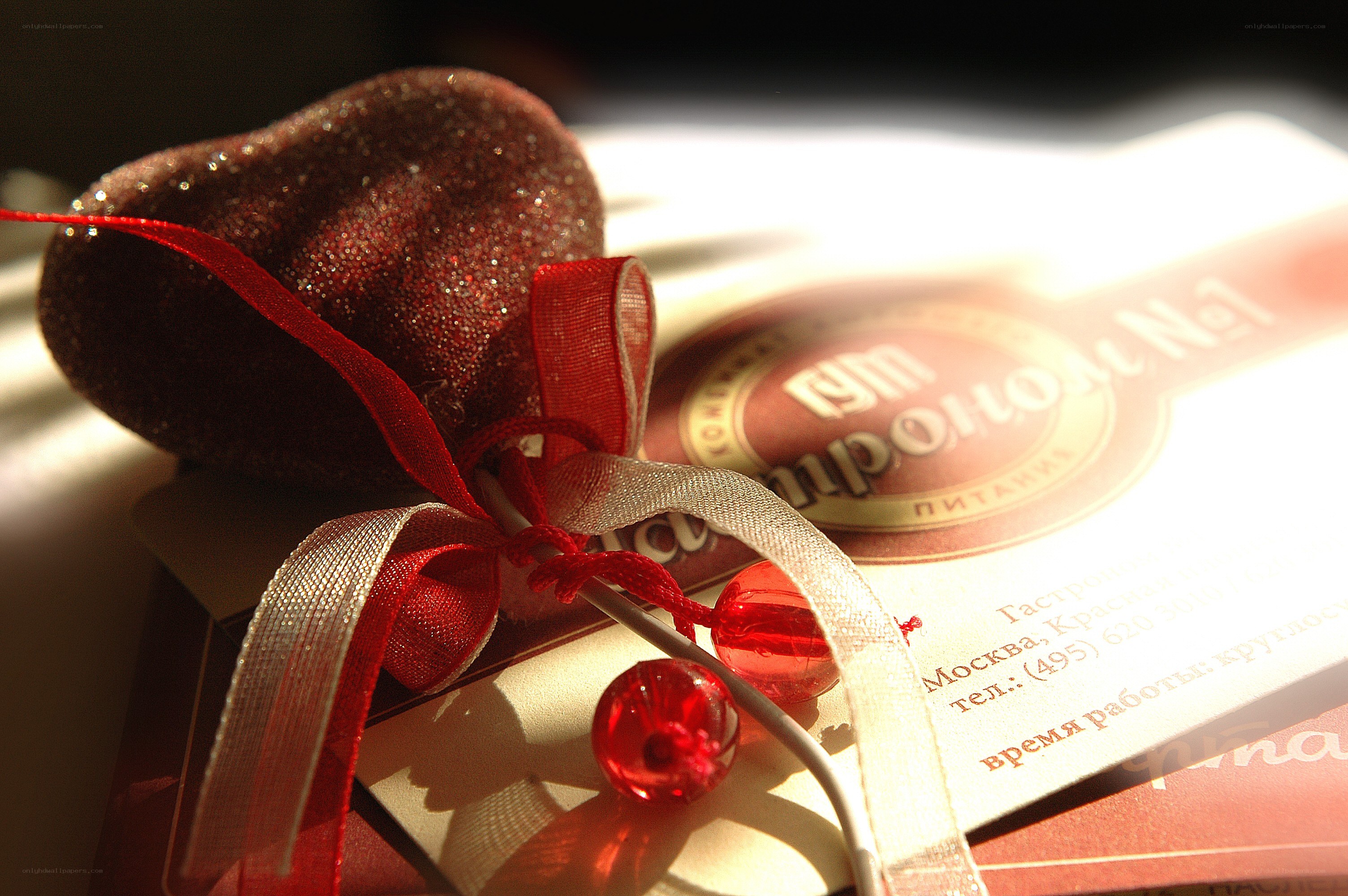 Heart-shaped gift with ribbon