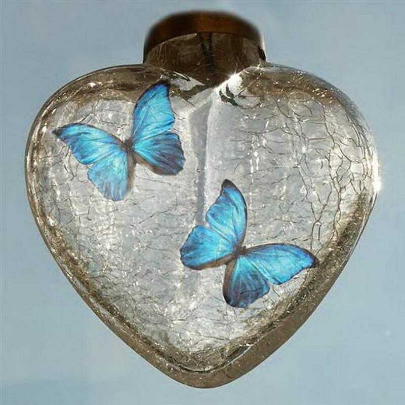 heart-shaped glass ornament with butterflies