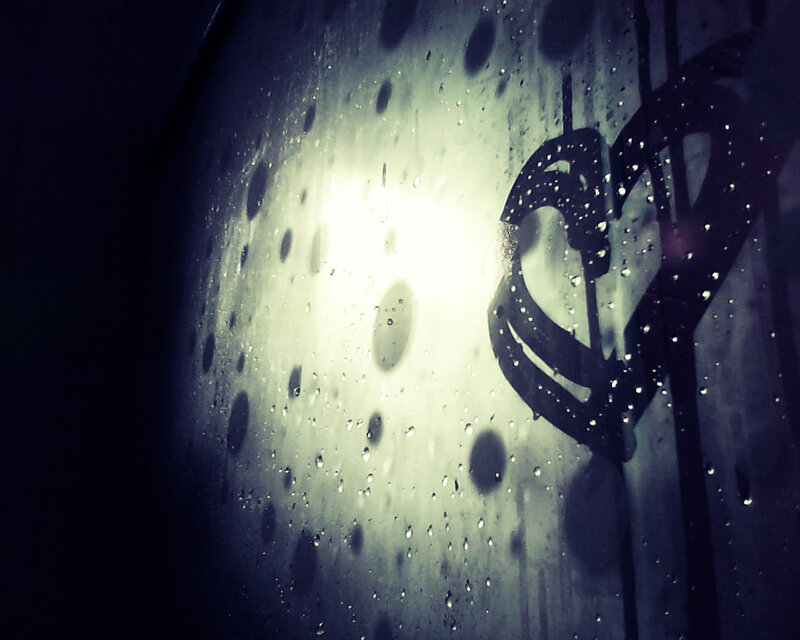 Heart-shaped Graffiti on Wet Glass