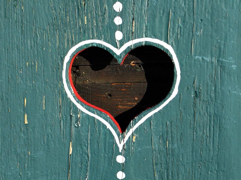 heart-shaped hole in wooden door