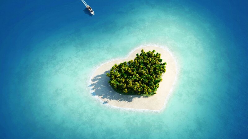 heart-shaped island in turquoise water