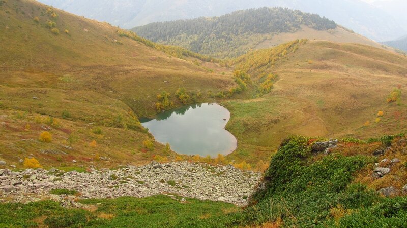 Heart-shaped Lake in Mountains — Green