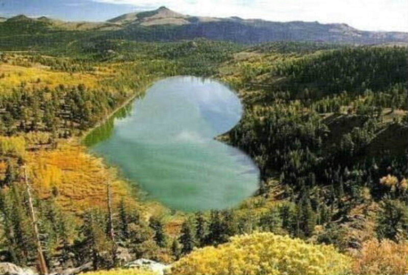 heart-shaped lake in mountains