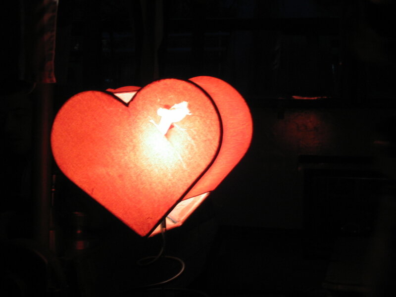 heart-shaped lamp in dark room