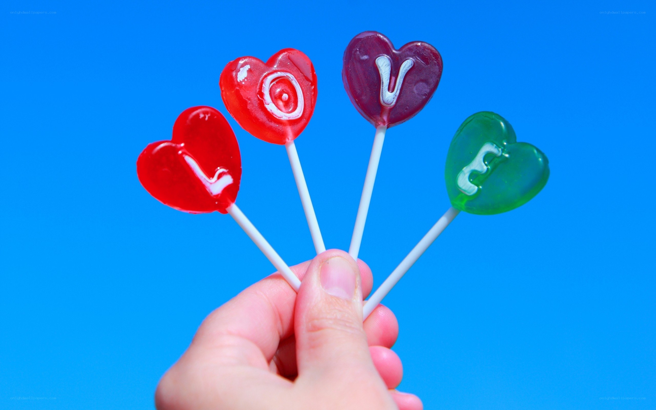 heart-shaped lollipops with love message