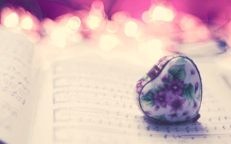 heart-shaped music box on sheet music
