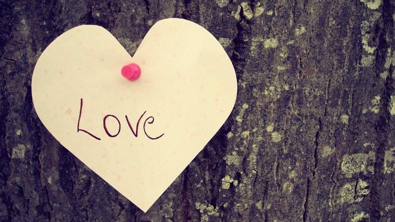 Heart-shaped note with 'Love' written on it