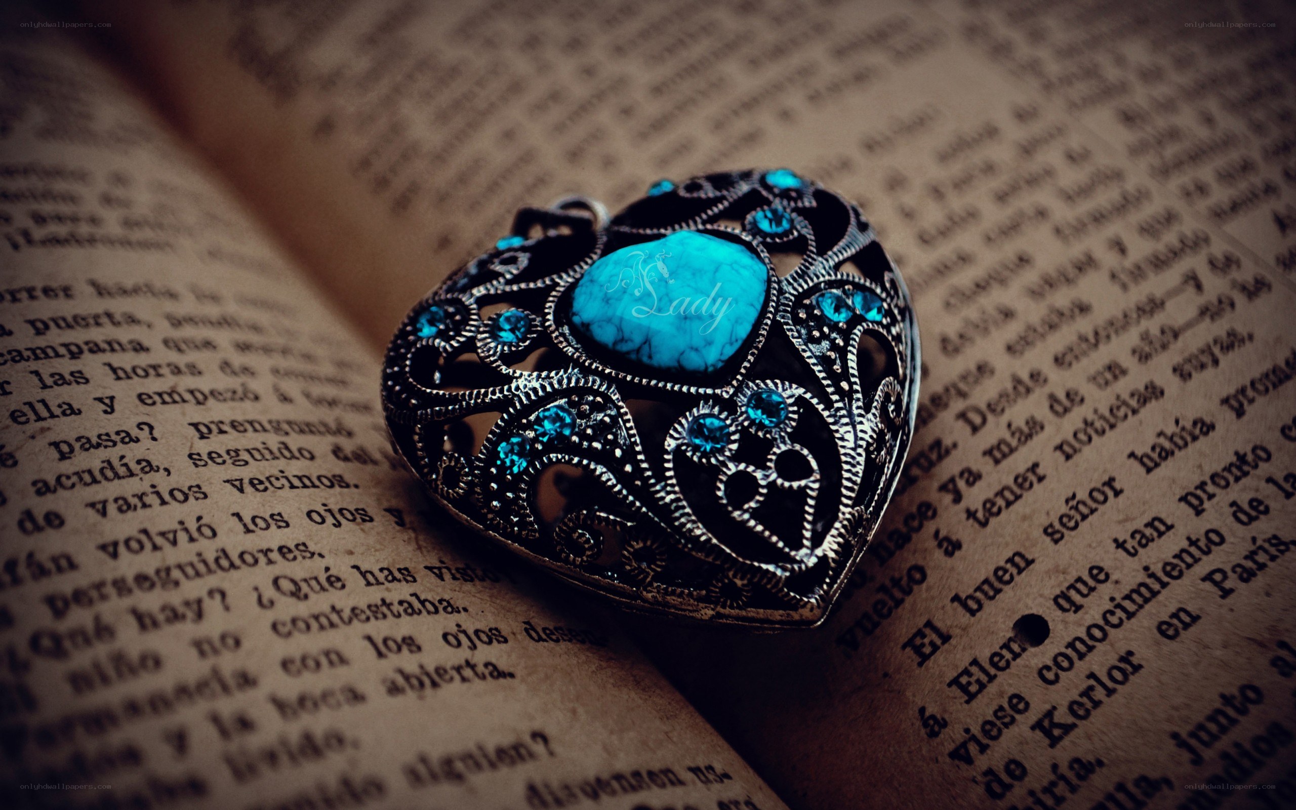 heart-shaped pendant on book