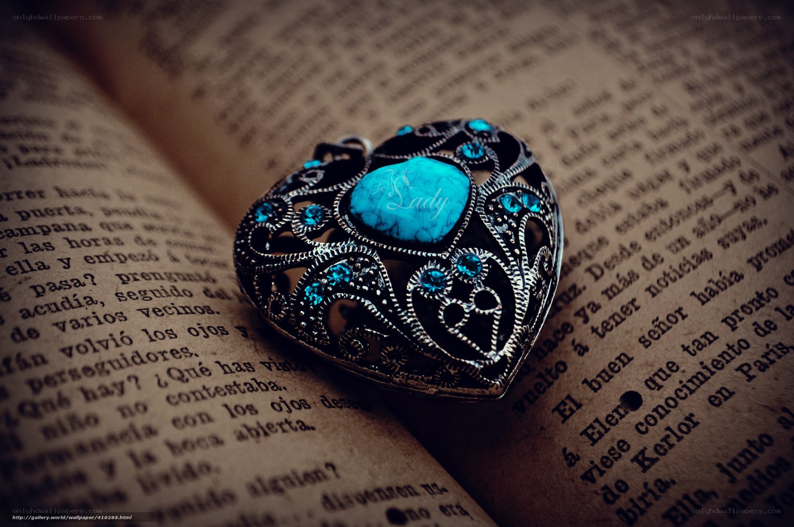 heart-shaped pendant on book