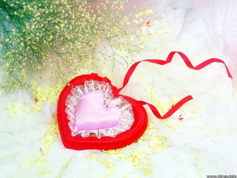 heart-shaped pillow with flowers