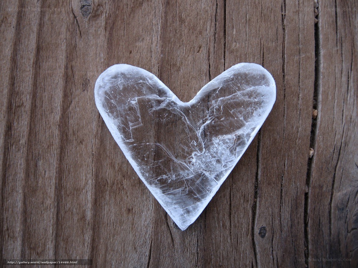 heart-shaped selenite on wood