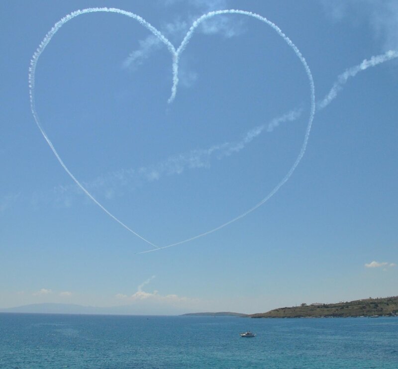 Heart-shaped smoke over the sea
